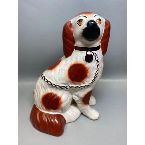 273 - REPRODUCTION PAIR OF STAFFORDSHIRE SEATED SPANIELS
