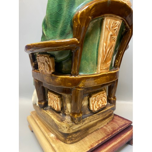 216 - CHINESE EARTHERNWARE SEATED EMPEROR FIGURE ON HARDWOOD STAND