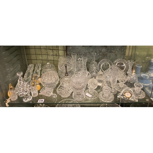 236 - SHELF OF VARIOUS CUT GLASSWARES INCLUDING DECORATIVE BELLS, POWDER BOWLS, ATOMISERS