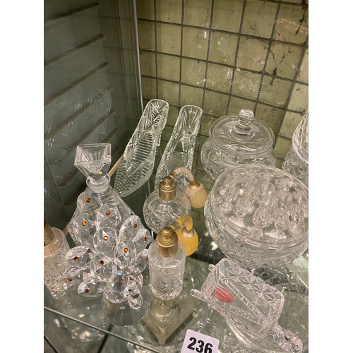 236 - SHELF OF VARIOUS CUT GLASSWARES INCLUDING DECORATIVE BELLS, POWDER BOWLS, ATOMISERS