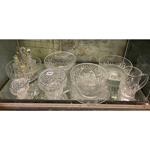 237 - BOTTOM SHELF OF CUT GLASS ROSE BOWLS, ETCHED FRUIT BOWLS, FOUR PIECE CRUET SET