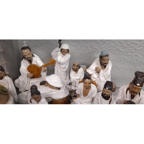 217 - SELECTION OF CHINESE EARTHERNWARE FIGURES OF MUSICIANS, MONKS