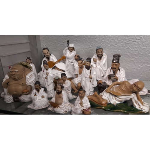 217 - SELECTION OF CHINESE EARTHERNWARE FIGURES OF MUSICIANS, MONKS