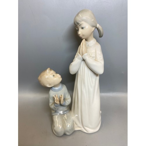 228 - FOUR LLADRO FIGURES OF BEDTIME CHILDREN AND A TRIO OF GEESE