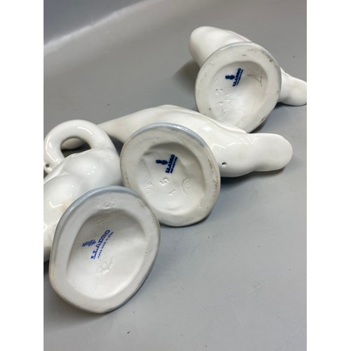 228 - FOUR LLADRO FIGURES OF BEDTIME CHILDREN AND A TRIO OF GEESE