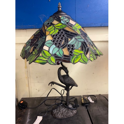 279 - METAL WORK CRANE FIGURAL TABLE LAMP WITH STAINED GLASS SHADE