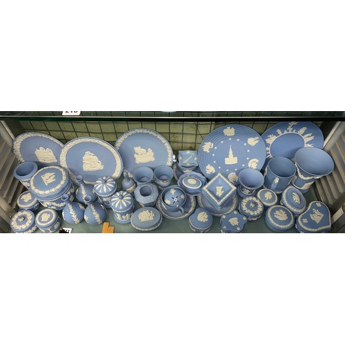 211 - SHELF OF WEDGWOOD POWDER BLUE JASPERWARE COMMEMORATIVE PLATES, DECORATIVE BELLS, POWDER BOXES AND TR... 