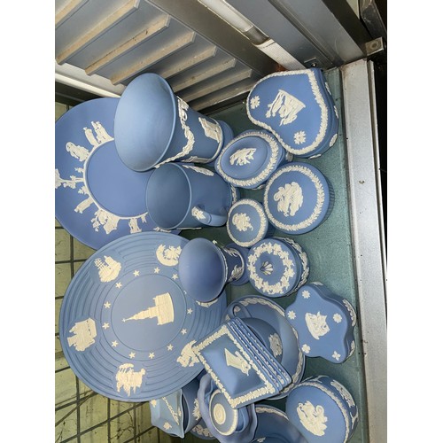 211 - SHELF OF WEDGWOOD POWDER BLUE JASPERWARE COMMEMORATIVE PLATES, DECORATIVE BELLS, POWDER BOXES AND TR... 