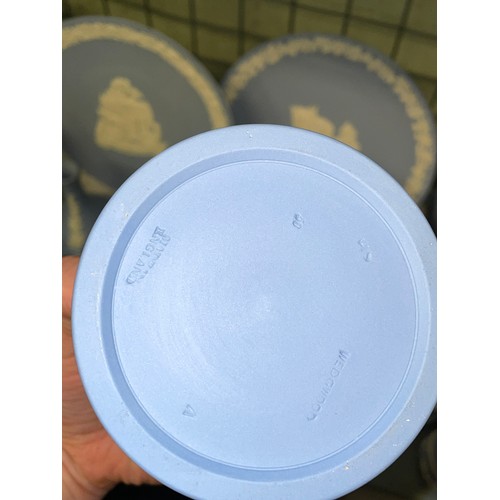 211 - SHELF OF WEDGWOOD POWDER BLUE JASPERWARE COMMEMORATIVE PLATES, DECORATIVE BELLS, POWDER BOXES AND TR... 