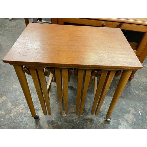 80 - NEST OF FOUR MINI DROP FLAP TEAK TABLES