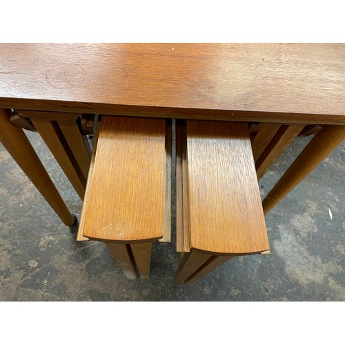 80 - NEST OF FOUR MINI DROP FLAP TEAK TABLES