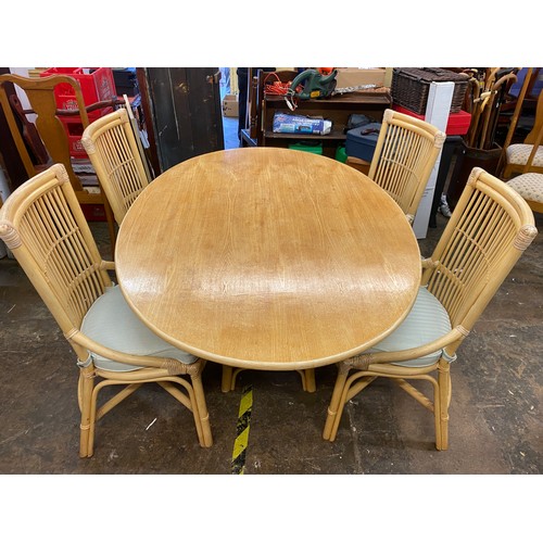 1 - OVAL TOPPED BAMBOO DINING TABLE WITH SIX CHAIRS WITH LOOSE CUSHIONS