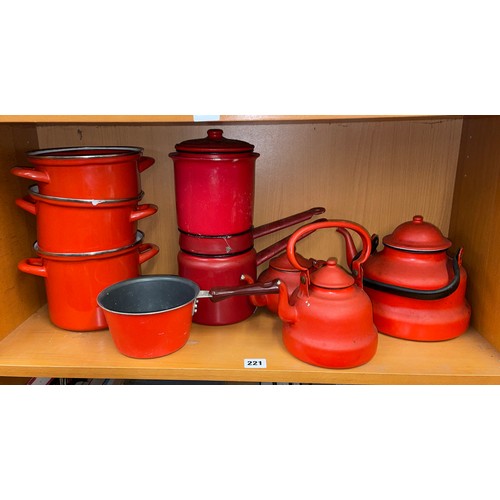 221 - SELECTION OF RED ENAMEL KITCHENWARE INCLUDING KETTLES, TEAPOT, AND SAUCEPANS