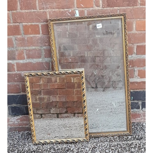 607 - TWO GILT FRAMED MIRRORS AND FOUR ASSORTED PRINTS