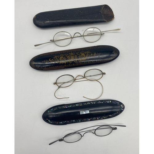 508 - STEEL FRAMED SPECTACLES IN PAPIER MACHE MOTHER OF PEARL INLAID CASES AND A SIMILAR CASE