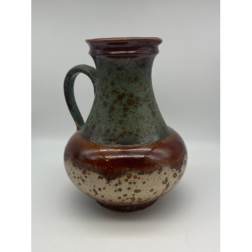 301 - GERMAN POTTERY 1808 MOTTLED HANDLED JUG