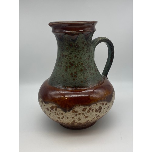 301 - GERMAN POTTERY 1808 MOTTLED HANDLED JUG