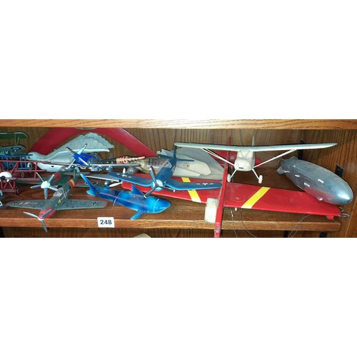 248 - SHELF OF MAINLY WWI MODELS OF GERMAN AND BRITISH BI PLANES AND ZEPPELIN