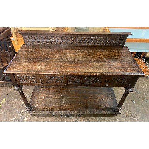 73 - 19TH CENTURY CARVED OAK TWO DRAWER SIDE TABLE WITH LEDGE