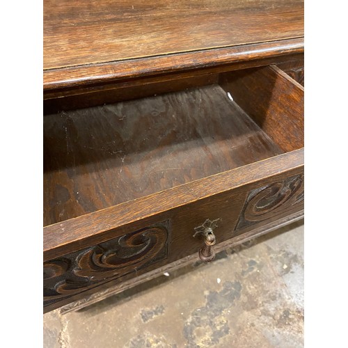 73 - 19TH CENTURY CARVED OAK TWO DRAWER SIDE TABLE WITH LEDGE