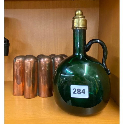 284 - 19TH CENTURY COPPER JELLY/PATE MOULD, AND GREEN GLASS CLARET JUG