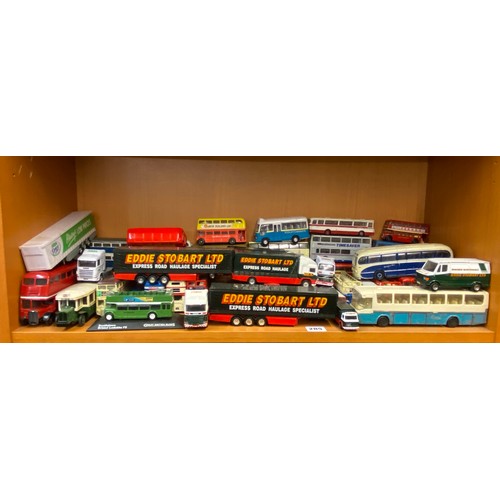 285 - TWO SHELVES OF DIE CAST MODELS OF DOUBLE DECKER BUSES, COACHES AND SOME EDDIE STOBART HAULAGE TRUCKS... 