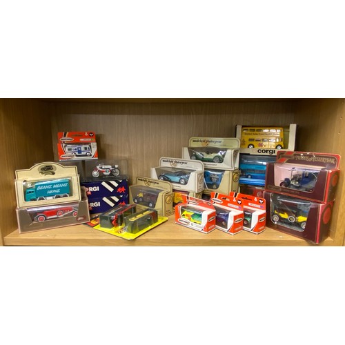 285 - TWO SHELVES OF DIE CAST MODELS OF DOUBLE DECKER BUSES, COACHES AND SOME EDDIE STOBART HAULAGE TRUCKS... 