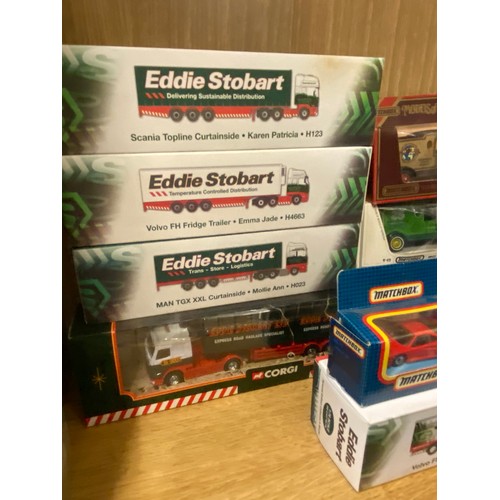 297 - BOXED DIECAST EDDIE STOBART HAULAGE WAGONS AND FLAT BED TRUCKS AND SOME OTHER BOXED DIE CAST CARS