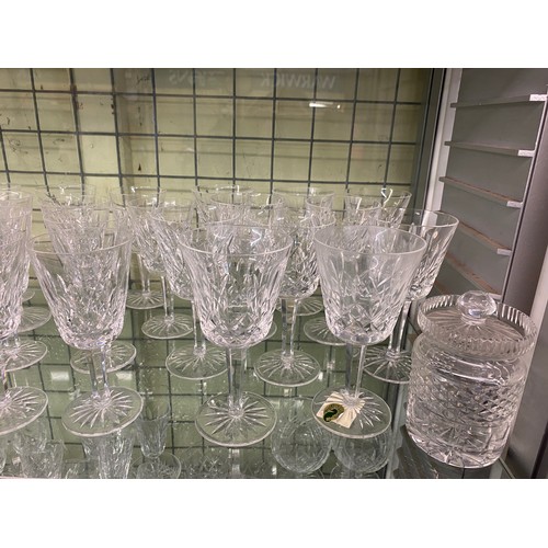 332 - SUITES OF WATERFORD CRYSTAL LISMORE PATTERN CUT GLASSWARE INC DECANTER, WINES, SHERRY AND FLUTES