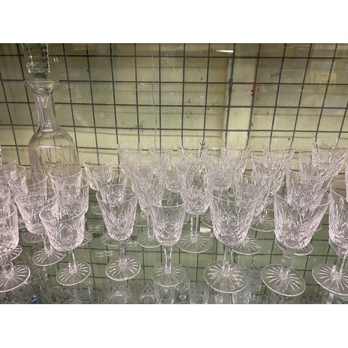 332 - SUITES OF WATERFORD CRYSTAL LISMORE PATTERN CUT GLASSWARE INC DECANTER, WINES, SHERRY AND FLUTES