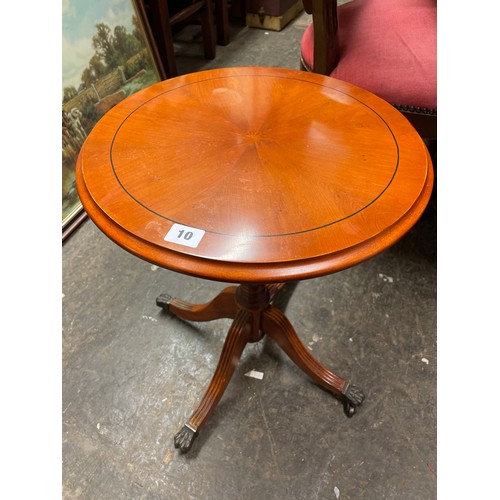 10 - YEW CIRCULAR PEDESTAL WINE TABLE ON LION PAW BRASS FEET