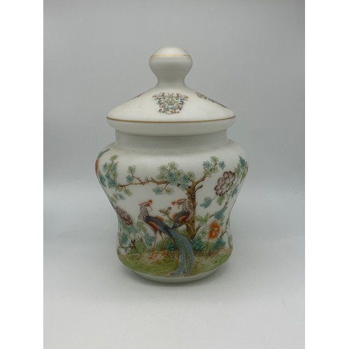 384 - OPAQUE GLASS SHAPED JAR AND COVER DECORATED WITH PEACOCKS AND FOLIAGE