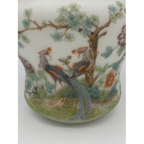 384 - OPAQUE GLASS SHAPED JAR AND COVER DECORATED WITH PEACOCKS AND FOLIAGE