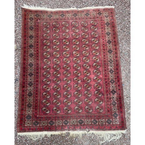 54 - EARLY 20TH CENTURY RED CAUCASIAN CARPET WITH GEOMETRIC DESIGN