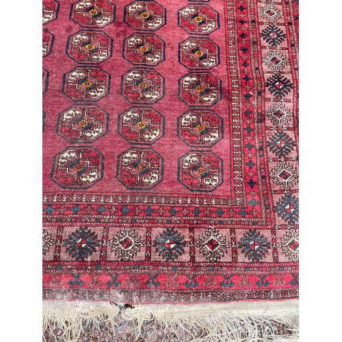 54 - EARLY 20TH CENTURY RED CAUCASIAN CARPET WITH GEOMETRIC DESIGN