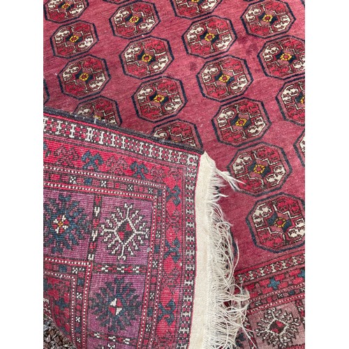 54 - EARLY 20TH CENTURY RED CAUCASIAN CARPET WITH GEOMETRIC DESIGN