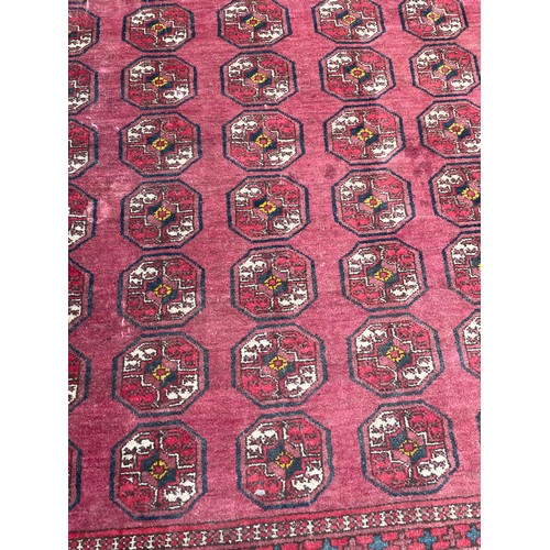 54 - EARLY 20TH CENTURY RED CAUCASIAN CARPET WITH GEOMETRIC DESIGN