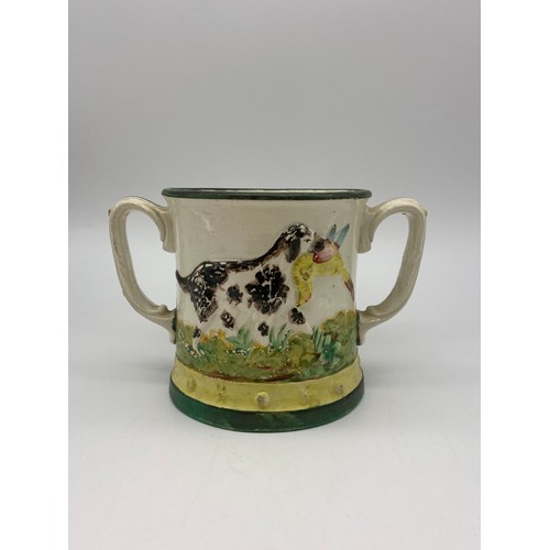 519 - 19TH CENTURY TWIN HANDLED STAFFORDSHIRE FROG LOVING CUP WITH HUNTING DOG DECORATION