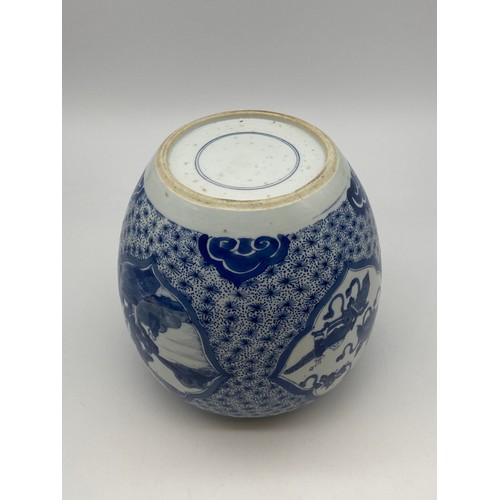 524 - CHINESE OVOID BLUE AND WHITE JAR DECORATED WITH PANELS PAINTED WITH LANDSCAPES AND ATTRIBUTES