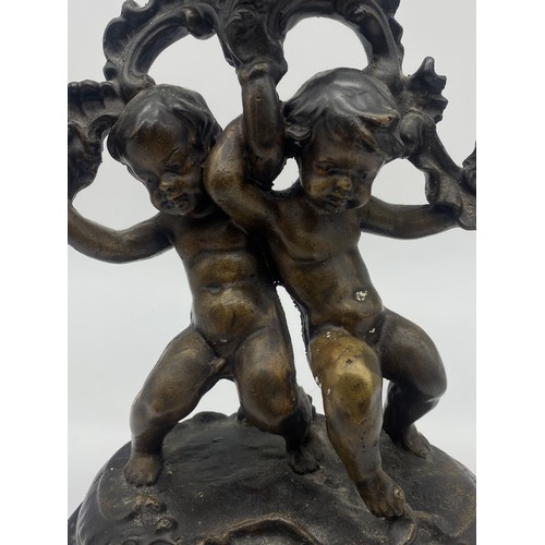 521 - REPRODUCTION TWIN CHERUB THREE BRANCH CANDELARBRUM ON SERPENTINE MARBLE BASE