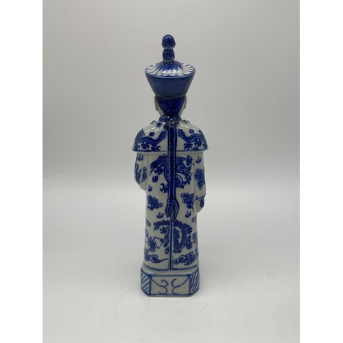 386 - THREE CHINESE BLUE AND WHITE AND DECORATIVE EMPEROR FIGURES