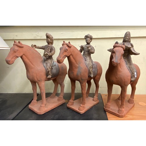 385 - THREE REPRODUCTION TERRACOTTA TANG DYNASTY STYLE CHINESE MUSICIAN FIGURES ON HORSE BACK