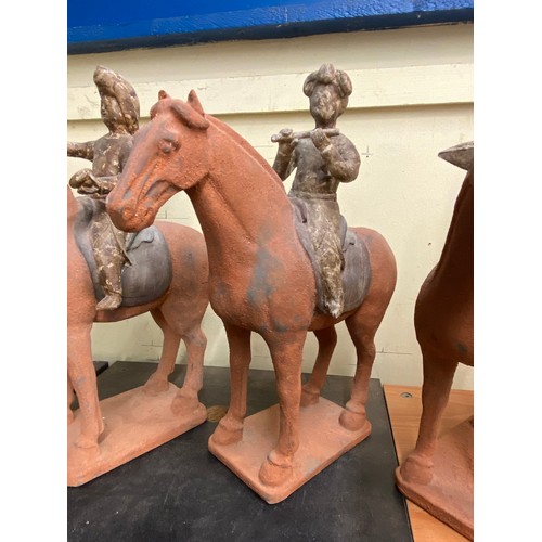 385 - THREE REPRODUCTION TERRACOTTA TANG DYNASTY STYLE CHINESE MUSICIAN FIGURES ON HORSE BACK