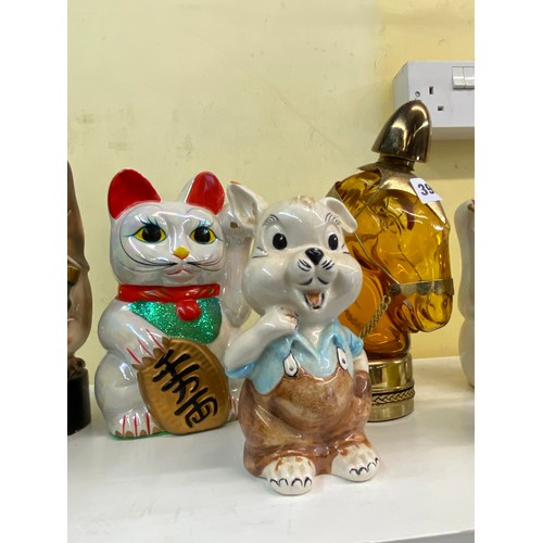 395 - NOVELTY POTTERY MONEY BANKS AND HORSE HEAD SPIRIT FLASK