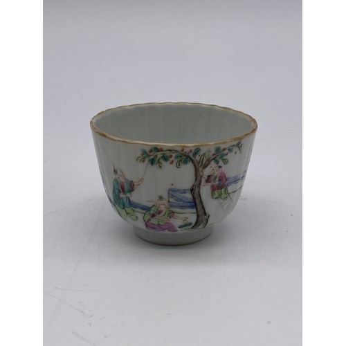 668 - TWO CHINESE RIBBED TEA BOWLS AND A CANTON FAMILLE ROSE MANDARIN TEABOWL AND SAUCER