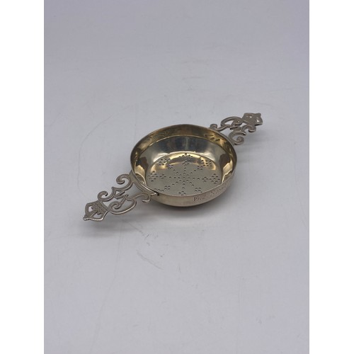 545 - SHEFFIELD SILVER TEA STRAINER WITH GEORGE VI MONOGRAM HANDLES 1.4OZ APPROX