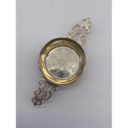 545 - SHEFFIELD SILVER TEA STRAINER WITH GEORGE VI MONOGRAM HANDLES 1.4OZ APPROX