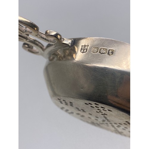 545 - SHEFFIELD SILVER TEA STRAINER WITH GEORGE VI MONOGRAM HANDLES 1.4OZ APPROX