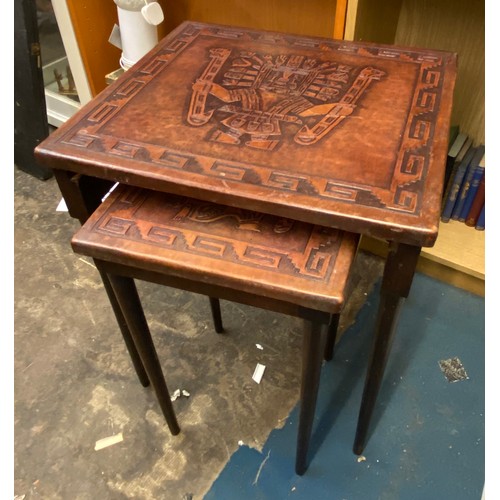 315 - LEATHER TOPPED NEST OF TWO TABLES WITH EMBOSSED AZTEC DESIGN