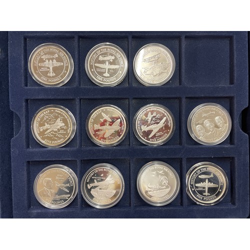 645 - CASE CONTAINING ELEVEN FIVE POUND COINS GUERNSEY, GIBRALTAR, JERSEY HISTORY OF THE ROYAL AIRFORCE